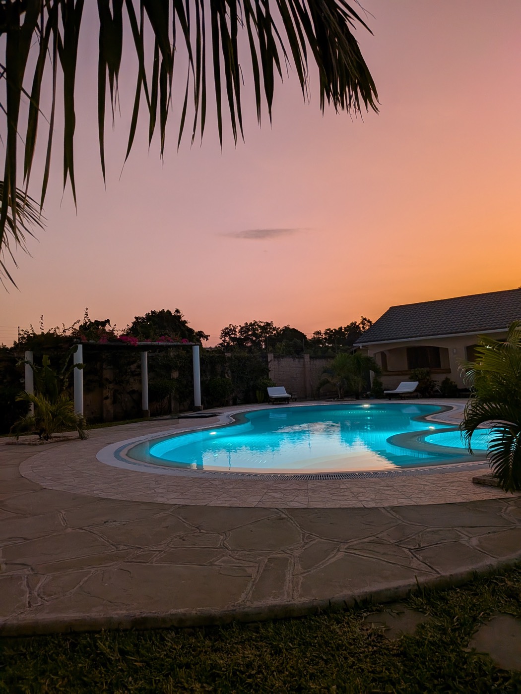 Villa pool at sunset on a Feels Timeless coastal getaway