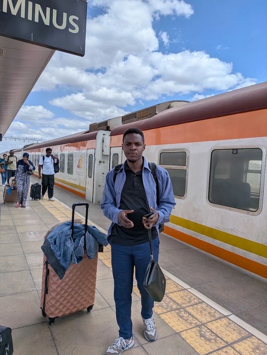 Ahereza Joseph with his suitcase on the platform at Nairobi Terminus